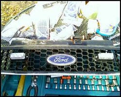ai233.photobucket.com_albums_ee229_hawkspringsfire_Ford_20Escape_20Install_grille4.jpg